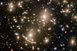 Distorted images of remote galaxies. Credit: NASA